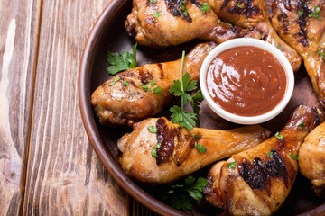 Grilled chicken legs with tomato sauce BBQ food background