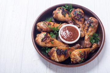 Grilled chicken legs with tomato sauce BBQ food background