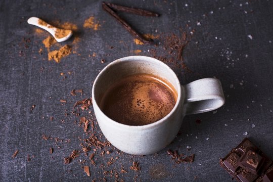 Hot chocolate with block of chocolate, milk cinnamon and sea salt