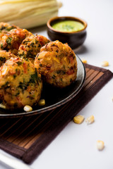Crispy Corn Tikki, pakora/pakoda or pattice also known as cutlet. served with green chutney. Selective focus