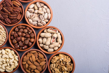 Mix of nuts : Pistachios, almonds , walnuts , pine nut , hazelnuts and cashew . Snack in bowl backgrond