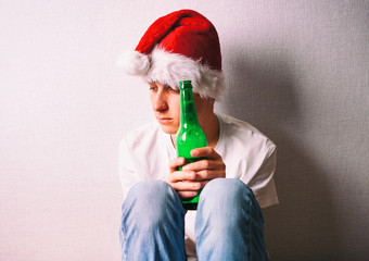 Sad Young Man in Santa Hat