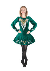 Beautiful young woman in Irish dance green dress isolated
