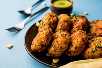Crispy Corn Tikki, pakora/pakoda or pattice also known as cutlet. served with green chutney. Selective focus