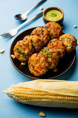Crispy Corn Tikki, pakora/pakoda or pattice also known as cutlet. served with green chutney. Selective focus