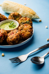 Crispy Corn Tikki, pakora/pakoda or pattice also known as cutlet. served with green chutney. Selective focus