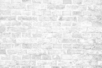 Simple grungy white brick wall with light and dark gray shades seamless pattern surface wall texture background.