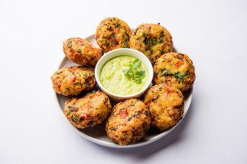 Crispy Corn Tikki, pakora/pakoda or pattice also known as cutlet. served with green chutney. Selective focus