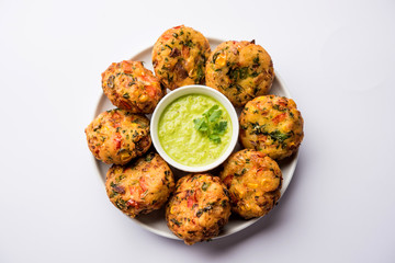 Crispy Corn Tikki, pakora/pakoda or pattice also known as cutlet. served with green chutney. Selective focus