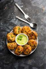 Crispy Corn Tikki, pakora/pakoda or pattice also known as cutlet. served with green chutney. Selective focus