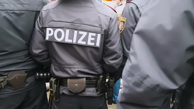 Policemen patrolling on city demonstration, law enforcement service, protest