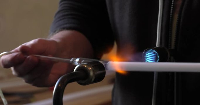 Male Hands Making neon lightbulbs. Hand Welding Glass Tubes. 4K, UHD, 50p, Cinematic,Close-up, 						