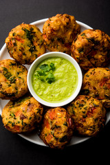 Crispy Corn Tikki, pakora/pakoda or pattice also known as cutlet. served with green chutney. Selective focus