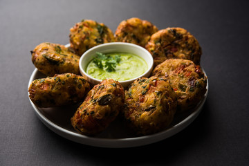 Crispy Corn Tikki, pakora/pakoda or pattice also known as cutlet. served with green chutney. Selective focus