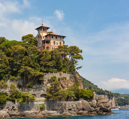 Beautiful buildings on the cliffs overlooking the beautiful harbour at Portofino on hte Ligurian coast, Italy