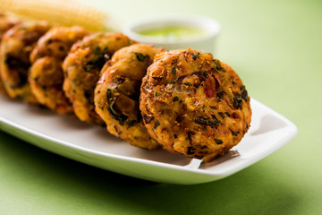 Crispy Corn Tikki, pakora/pakoda or pattice also known as cutlet. served with green chutney. Selective focus