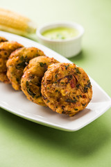 Crispy Corn Tikki, pakora/pakoda or pattice also known as cutlet. served with green chutney. Selective focus