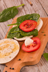 Tigella bread with spinach and tomatoes.