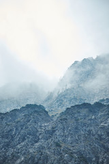 Dramatic Mountain Range With Stormy Clouds In The Sky - Blue Color