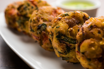 Crispy Corn Tikki, pakora/pakoda or pattice also known as cutlet. served with green chutney. Selective focus