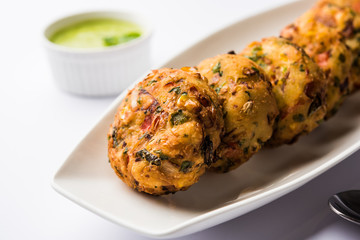 Crispy Corn Tikki, pakora/pakoda or pattice also known as cutlet. served with green chutney. Selective focus