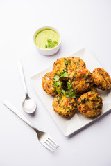 Crispy Corn Tikki, pakora/pakoda or pattice also known as cutlet. served with green chutney. Selective focus