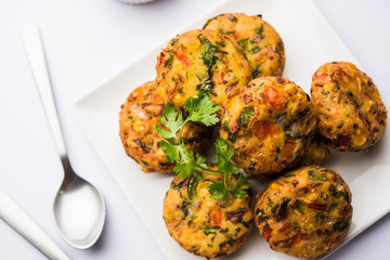 Crispy Corn Tikki, pakora/pakoda or pattice also known as cutlet. served with green chutney. Selective focus