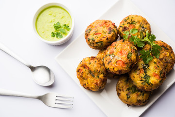 Crispy Corn Tikki, pakora/pakoda or pattice also known as cutlet. served with green chutney. Selective focus