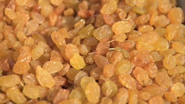 dried fruits background. Yellow delicious sweet raisins close up