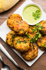 Crispy Corn Tikki, pakora/pakoda or pattice also known as cutlet. served with green chutney. Selective focus