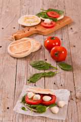 Tigella bread with spinach and tomatoes.
