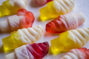 Bright candies on a white background, close up.