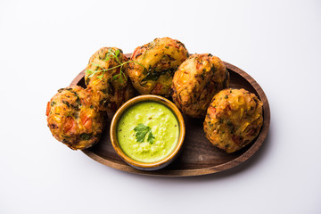 Crispy Corn Tikki, pakora/pakoda or pattice also known as cutlet. served with green chutney. Selective focus