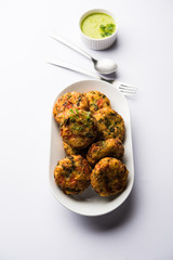 Crispy Corn Tikki, pakora/pakoda or pattice also known as cutlet. served with green chutney. Selective focus