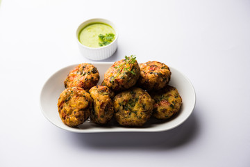 Crispy Corn Tikki, pakora/pakoda or pattice also known as cutlet. served with green chutney. Selective focus