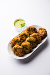 Crispy Corn Tikki, pakora/pakoda or pattice also known as cutlet. served with green chutney. Selective focus