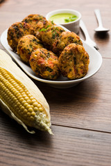 Crispy Corn Tikki, pakora/pakoda or pattice also known as cutlet. served with green chutney. Selective focus