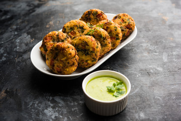 Crispy Corn Tikki, pakora/pakoda or pattice also known as cutlet. served with green chutney. Selective focus