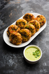 Crispy Corn Tikki, pakora/pakoda or pattice also known as cutlet. served with green chutney. Selective focus