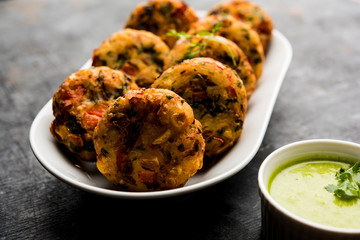 Crispy Corn Tikki, pakora/pakoda or pattice also known as cutlet. served with green chutney. Selective focus