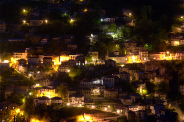 Fototapeta na wymiar Mountain village, street lights at night landmark view
