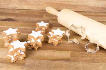 Delicious Christmas biscuits with cookie cutter and rolling pin