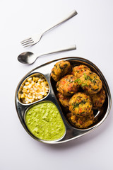Crispy Corn Tikki, pakora/pakoda or pattice also known as cutlet. served with green chutney. Selective focus
