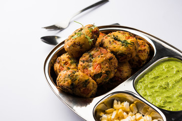 Crispy Corn Tikki, pakora/pakoda or pattice also known as cutlet. served with green chutney. Selective focus