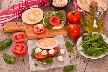 Tigella bread with spinach and tomatoes.