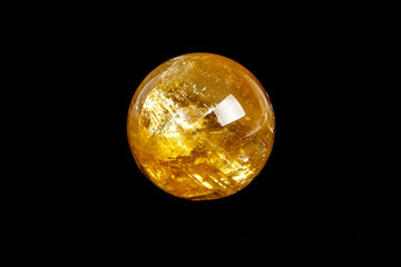 Macro mineral stone Calcite orb on a black background