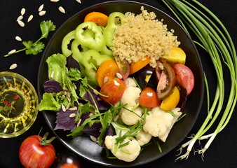 Vegetarian salad with quinoa, vegetables and sunflower seeds. Buddha bowl, top view 