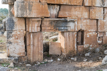 The remains  of the wall on the ruins of the destroyed Roman temple, located in the fortified city on the territory of the Naftali tribe. Tel Kadesh in the north of Israel
