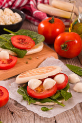 Tigella bread with spinach and tomatoes.