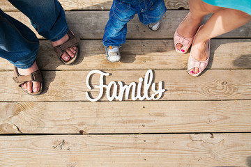 the inscription on the family nature of the bridge three people.